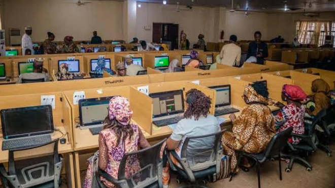 Teachers inputting classroom assessment marks into the multi-user editor workspace in Kaduna, Nigeria.