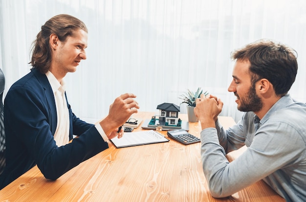 A real estate agent discussing property details with clients.