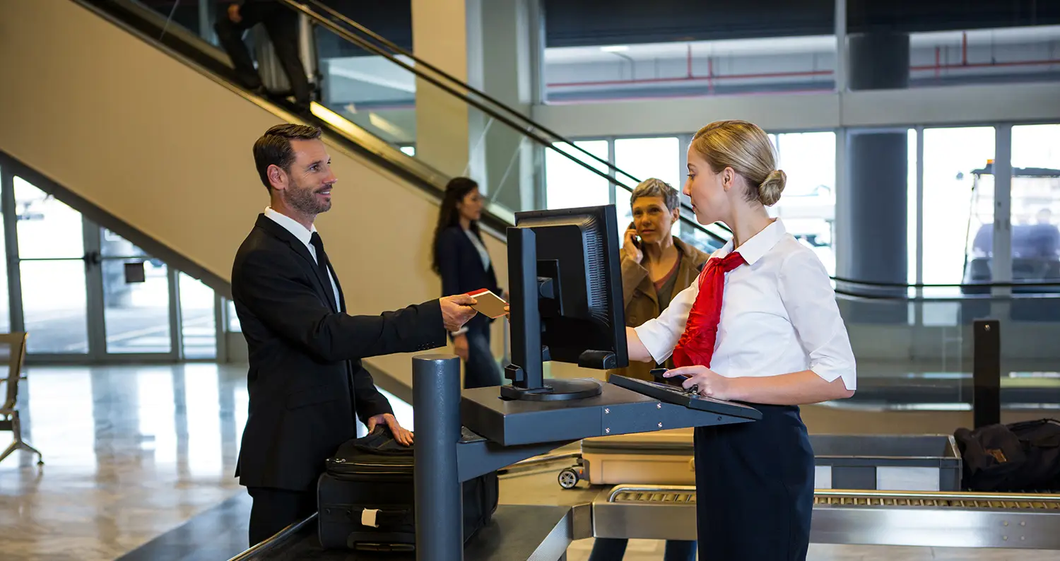 Busy passenger check-in hall inside an international airport terminal.