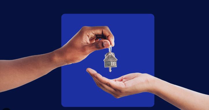 Close-up of house keys being handed over in a new apartment.