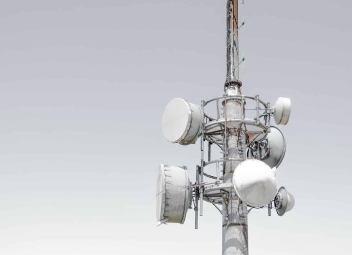 Telecommunication antenna tower transmitting data signals across a metropolitan area.