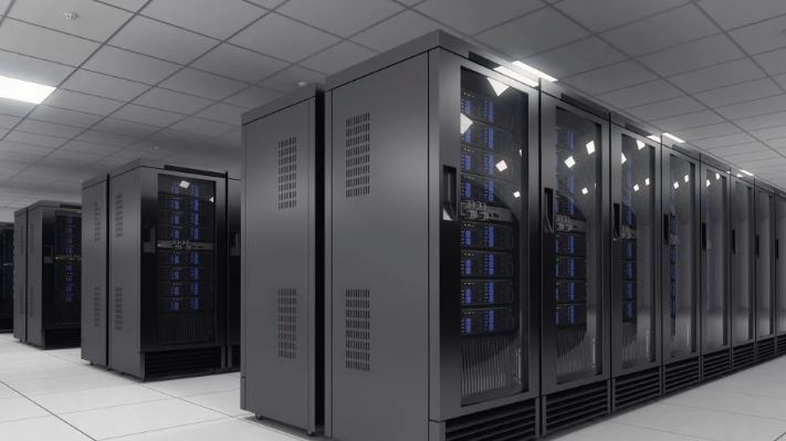 Rows of glowing server racks inside a secure tech facility.
