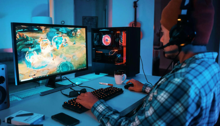 Gamer playing an action role-playing game on a high-end desktop monitor.