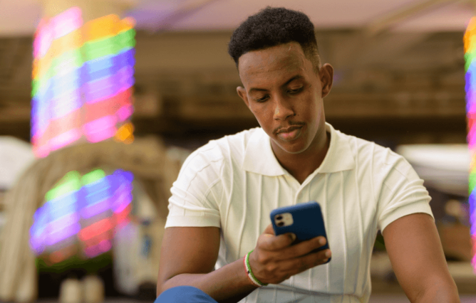 Subscriber operating mobile devices inside a local business hub workspace in Lagos, Nigeria.
